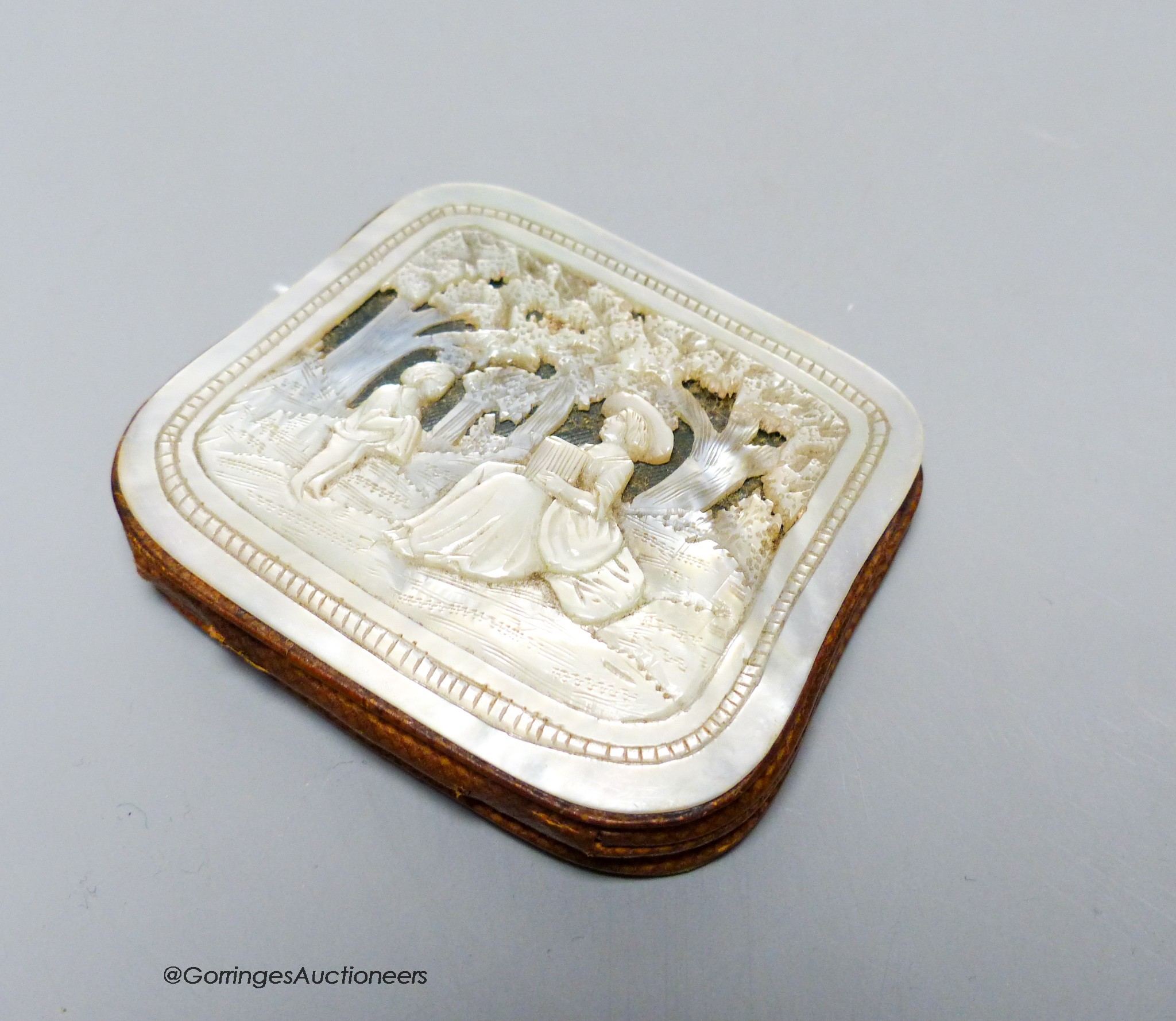 A 19th century carved mother of pearl purse, 6 x 7cm